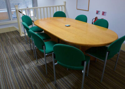 The Mezzanine - A small but bright meeting space with large oval table and eight chairs
